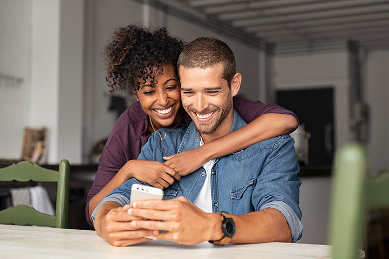 A couple looking at a phone